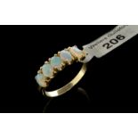 Five stone opal ring, five oval cabochon cut opals set in 9ct yellow gold, ring size O