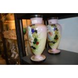 A pair of Victorian opaque glass vases decorated with panels depicting figures in woodland
