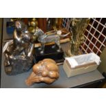 *A group of reproduction figurines including oriental woman, embracing couple, relic, guide dog