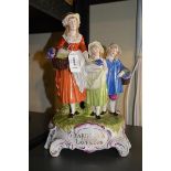 A Dresden Yardley's English lavender ornament comprising a group of three lavender pickers with