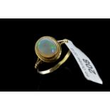 Single stone opal ring, oval cabochon cut opal, set in 9ct yellow gold, ring size L