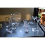 A collection of 19th century glass comprising a jug and two stemmed glasses engraved with ferns,