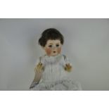 A Bahr und Proschild 585 bisque headed doll, with blue sleeping eyes, open mouth with four teeth,