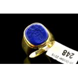Lapis lazuli seal signet ring, oval lapis lazuli stone with seal engraving of crest containing a