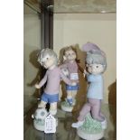 Three Lladro sporting figures: 5134 Sporty Susi Footballer, 5135 Sporty Billy Footballer and 5137