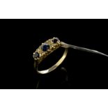 Sapphire and diamond ring, three round cut sapphires each separated by two Swiss cut diamonds, in
