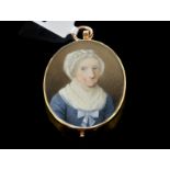 Oval portrait pendant, oval painted portrait of a lady, in blue dress and white scarf, mounted in
