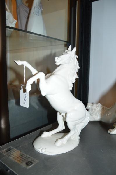 A Nymphenburg porcelain figure of a stallion, 23cm high