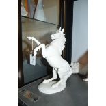 A Nymphenburg porcelain figure of a stallion, 23cm high