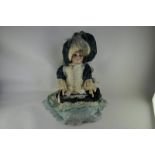 A Simon and Halbig 1079 bisque headed doll with sleeping brown eyes, open mouth with four teeth,