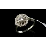 Diamond cluster ring, central round brilliant cut diamond weighing an estimated 0.50ct, surrounded