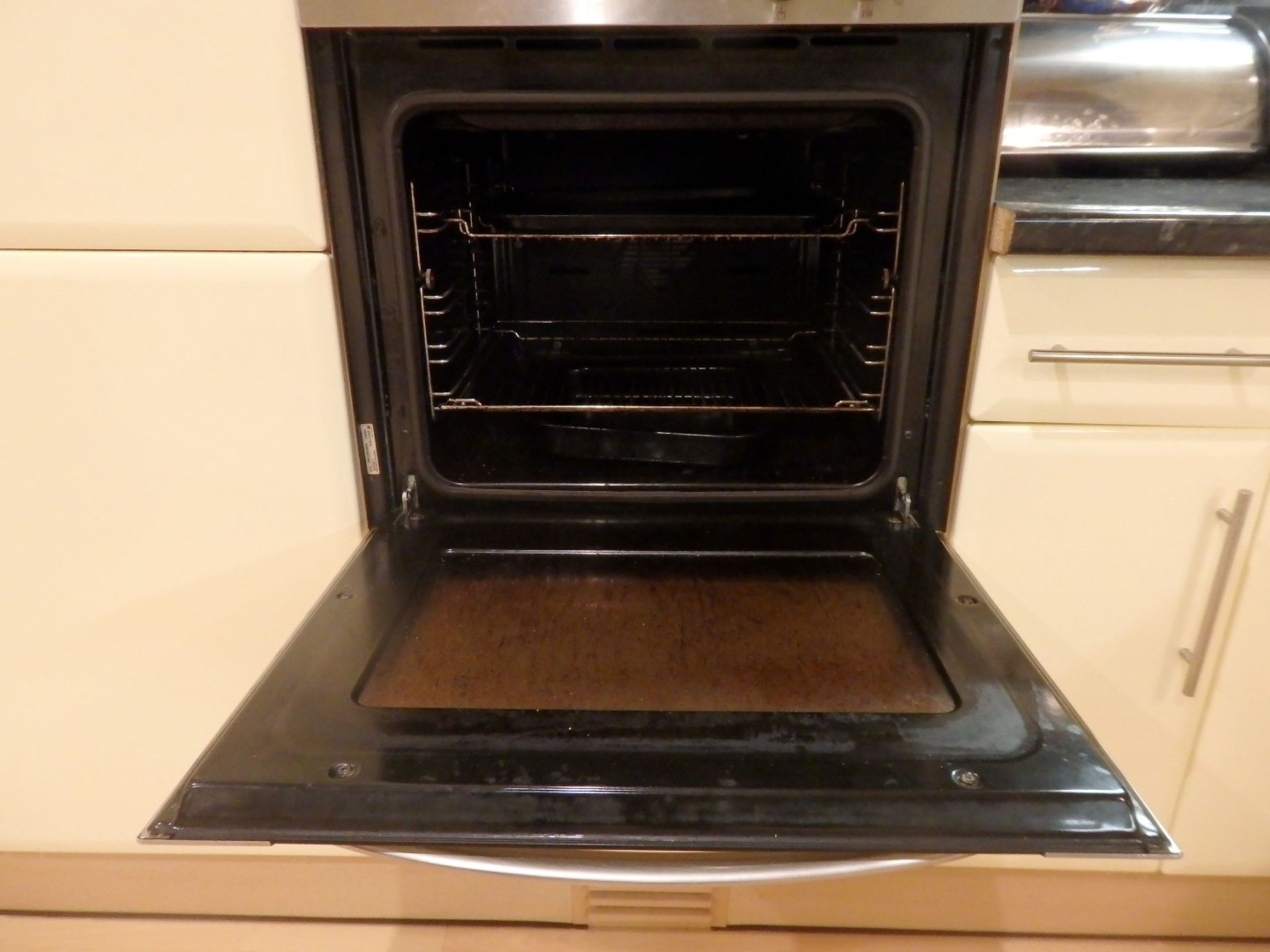 1 x Hygena Fitted Kitchen - Cream Gloss Doors With T Bar Handles - Black Granite Worktops - Bosch - Image 58 of 77