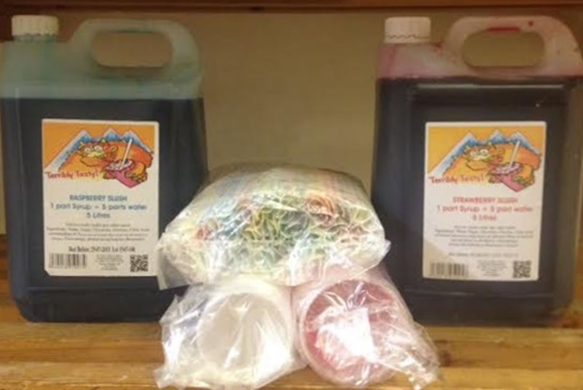 Assorted Lot of Slush Puppy Syrup, Cups and Straws - Includes 2 x 5 Litre Strawberry Syrup, 2 x 5
