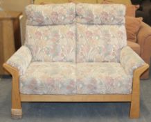 1 x Cintique “Hartford” 2-Seater Sofa - Original RRP £1,199 – Floral Patterned Upholstery On A Light