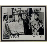 OASIS: Signed 10 x 8 photograph by all f