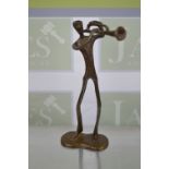 A stylised bronze figure of a trumpet player of flat form