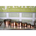 Collection of French copper cooking pots various sizes