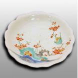 Round Kakiemon saucer, 17th centuryA late 17th century rounded Kakiemon plate decorated with blue,