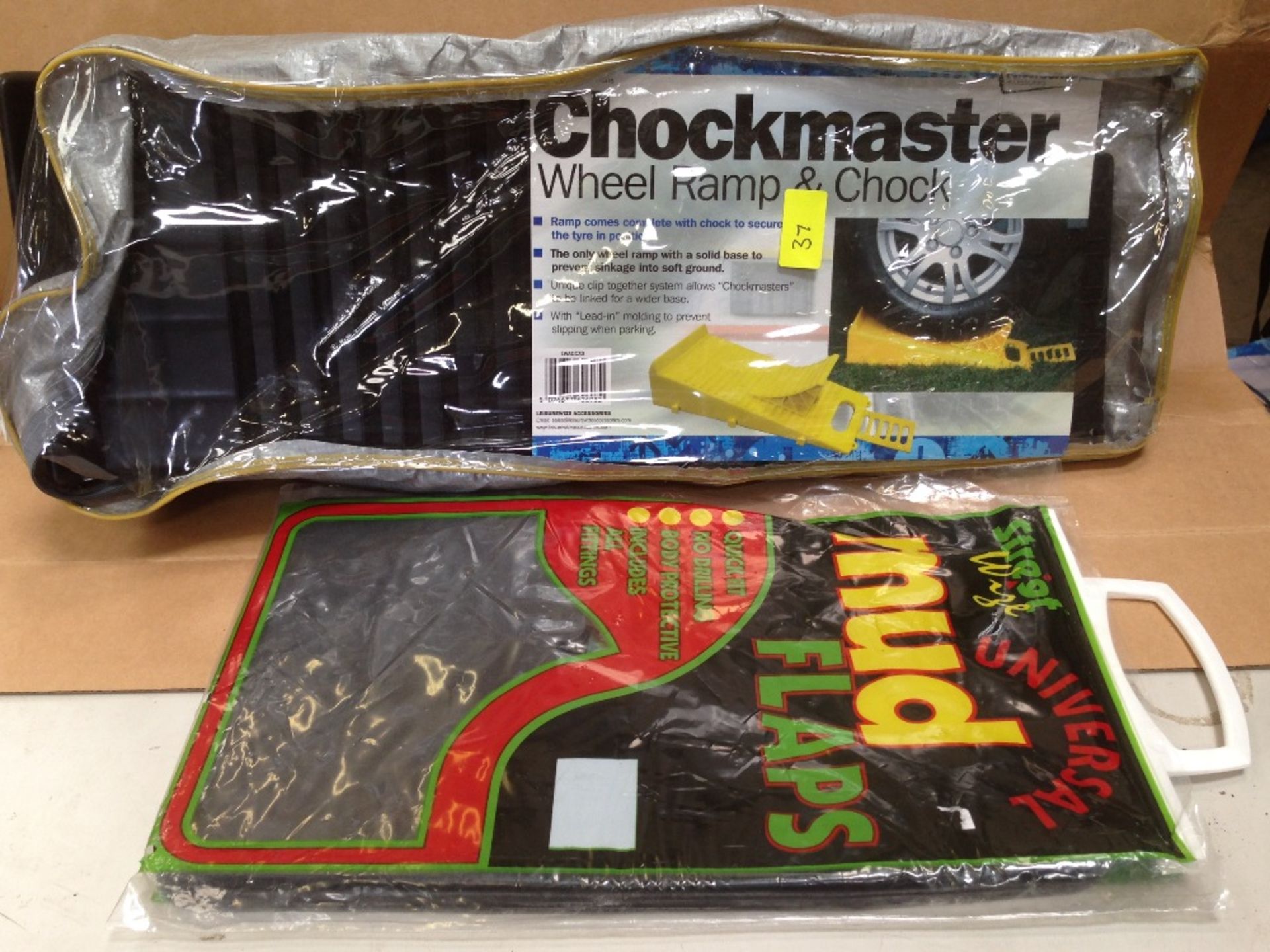 Assorted car items chockmaster and mud flaps unused sealed packaging