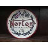 A reproduction cast metal wall sign for Norton motorcycles.