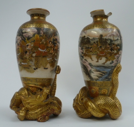 A pair of Japanese Satsuma vases decorated with warriors and fighting scenes each raised on - Image 2 of 2