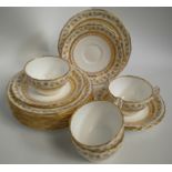 A part Mintons fine china tea set consisting of five tea cups, four saucers and eight plates, the