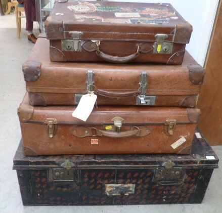 Three leather suitcases.