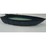 A Japanese blue china glazed dish in the form of a boat.