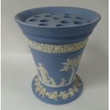 A Wedgwood blue Jasperware tapering table centre vase decorated with classical figures.