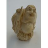 A Meiji period ( meeting CITES regulations ) carved ivory okimono depicting a portly man holding a