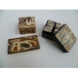 A Meiji period miniature Japanese ivory pin box decorated with figures in a garden and geometric