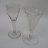 An early 19th century cordial glass engraved with bird and leaf design raised on a plain stem and