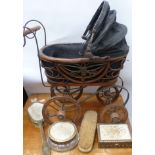 A reproduction Victorian child's doll perambulator and a four piece dressing table set.