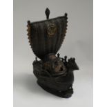 A Japanese bronze dragon boat incense burner with chicken bow decoration and painted gilt decoration