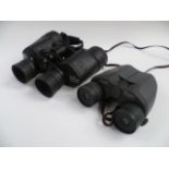 A pair of Viking 8 x 42 binoculars and a pair of Chinon zoom binoculars.