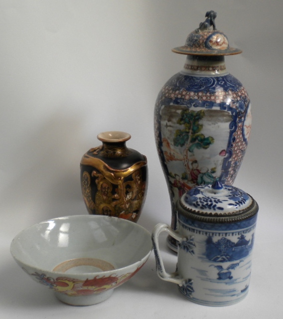 A collection of Japanese and Chinese porcelain to include a pair of covered vases, a double strap