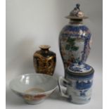 A collection of Japanese and Chinese porcelain to include a pair of covered vases, a double strap