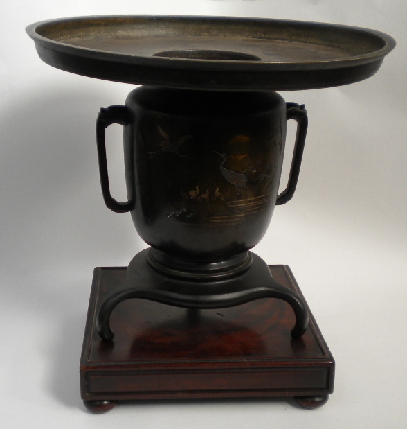 A Japanese bronze two-handled urn with etched and coloured metal inlaid scene depicting a family