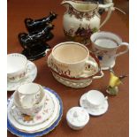 A lustre ware relief moulded jug, two black glazed and lustre cow creamers, a quantity of mainly