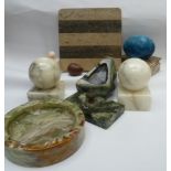 A collection of polished stone and similar ornamental items.