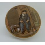 A circular Prattware pot with pot lid depicting a sleeping man 'On Guard'.