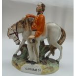 A Staffordshire flat back figure, 'Garibaldi', with his horse.
