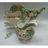 An early 19th century Davenport china milk jug with green chequered and floral spray pattern, two