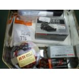 A Lipo-Safe containing various batteries and a Paladin L120 Pro charger.