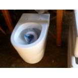 A brand new white ceramic toilet.