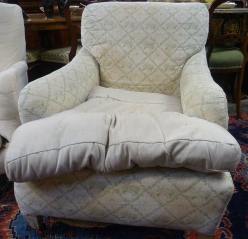 A Victorian Bridgewater style armchair with original 'PU' green floral decorated ticking to