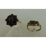 2 Goldringe m. Granat besetzt, 1 Ring 333 (2,3g.), 1 Ring 585 (besch.) 2,9g.Mindestpreis: 55 EUR