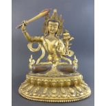 Bodhisattva Manjusri / ManjushriBronze, teilvergoldet, mit Halbedelsteinen besetzt. h. ca. 30 cm