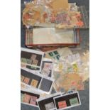 Tin of envelopes & packets of stamps