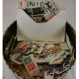 Tin of loose stamps